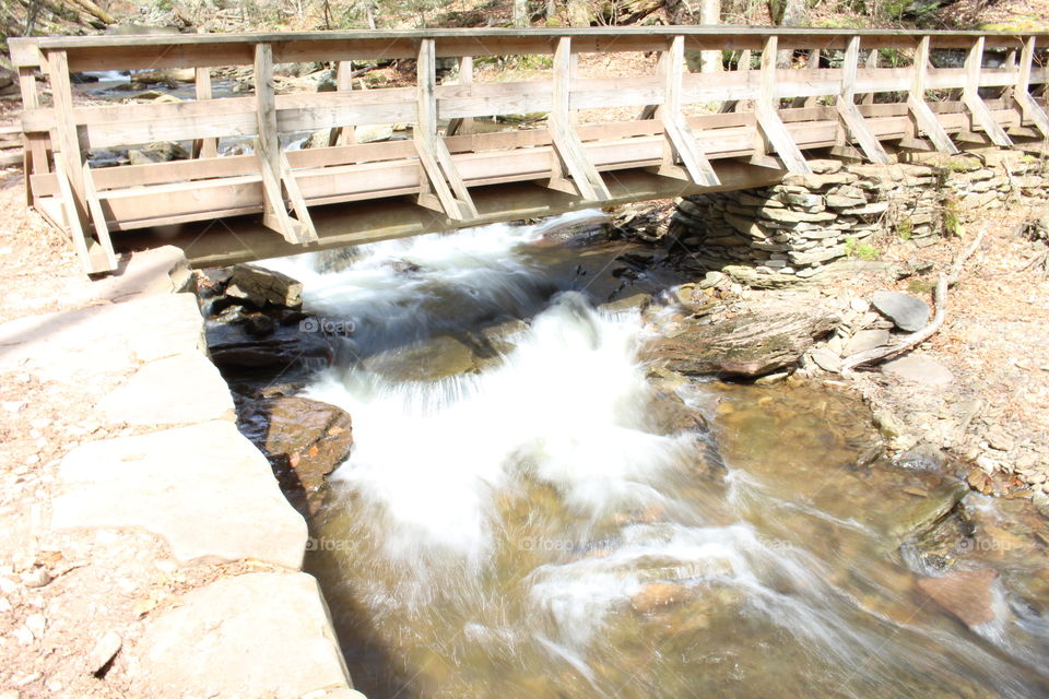 Bridge over rushing stream