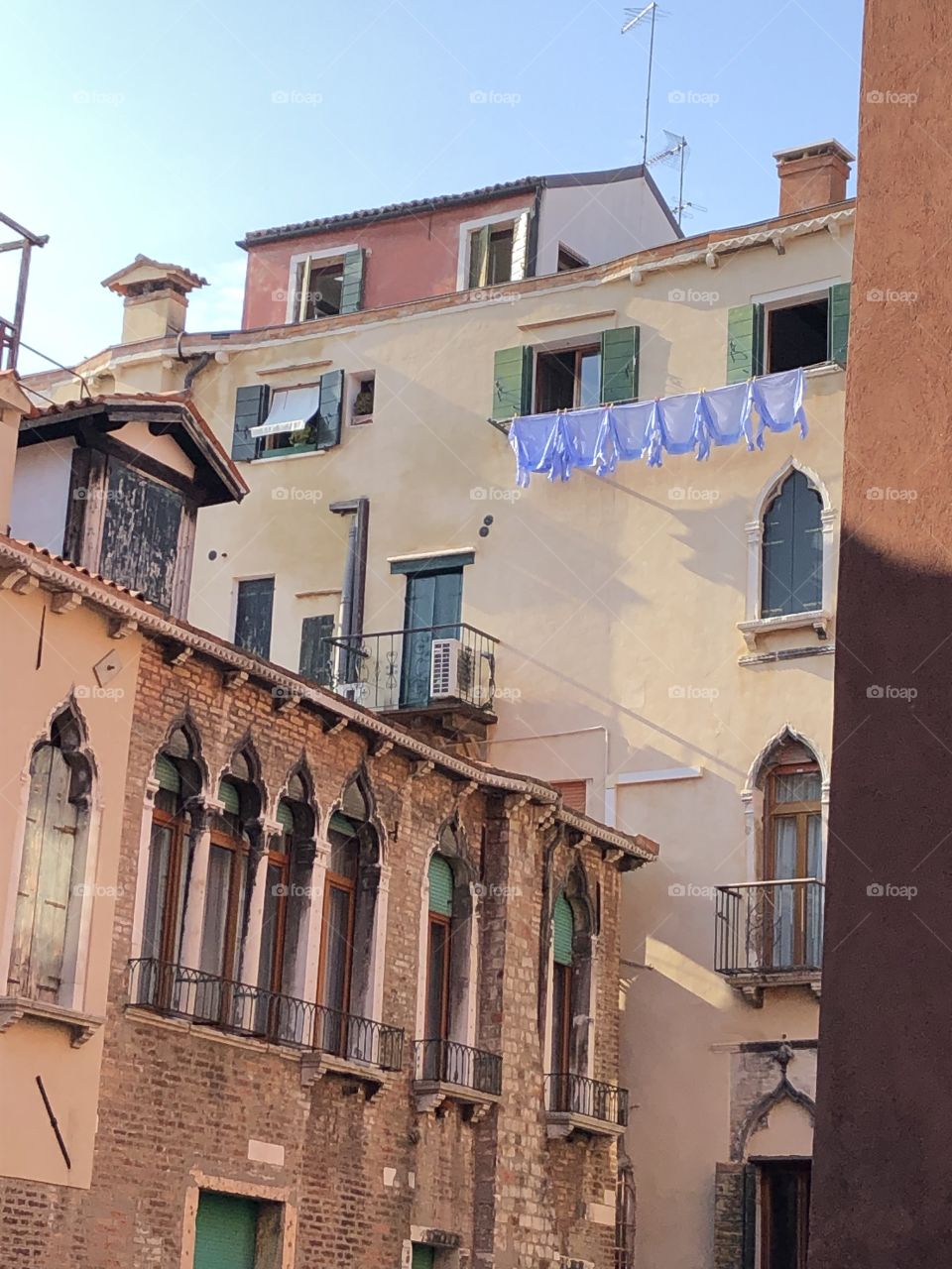Blue shirts on drying in Venice