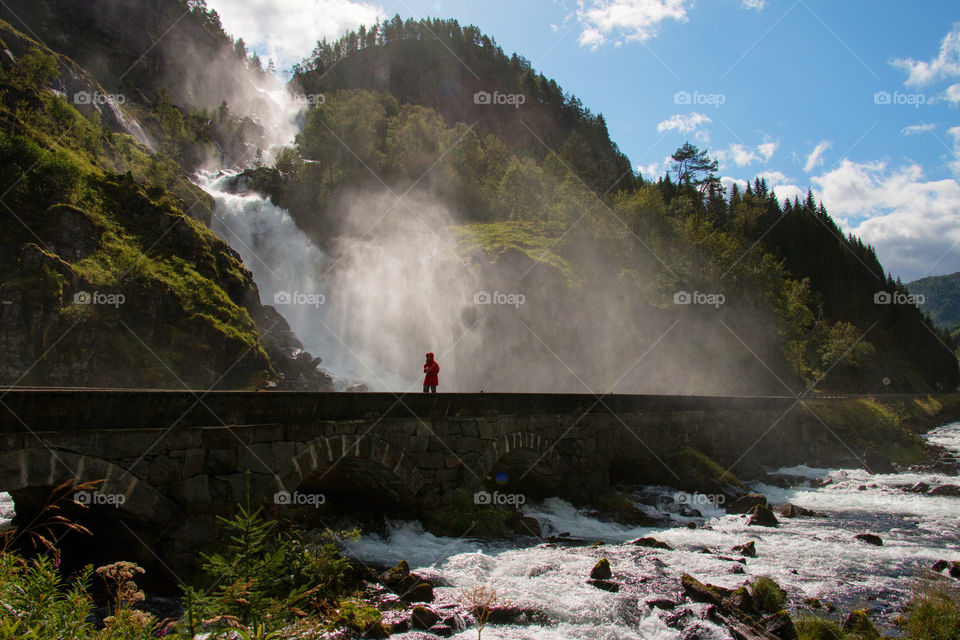 Woman getting splashed by water