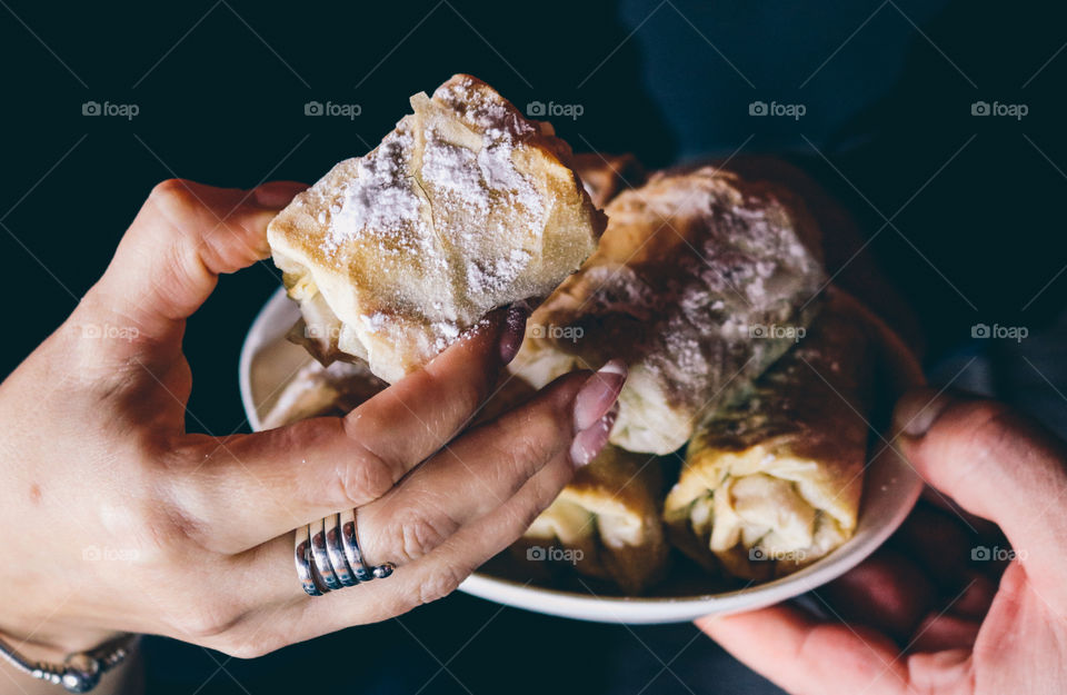 A woman holding a pie