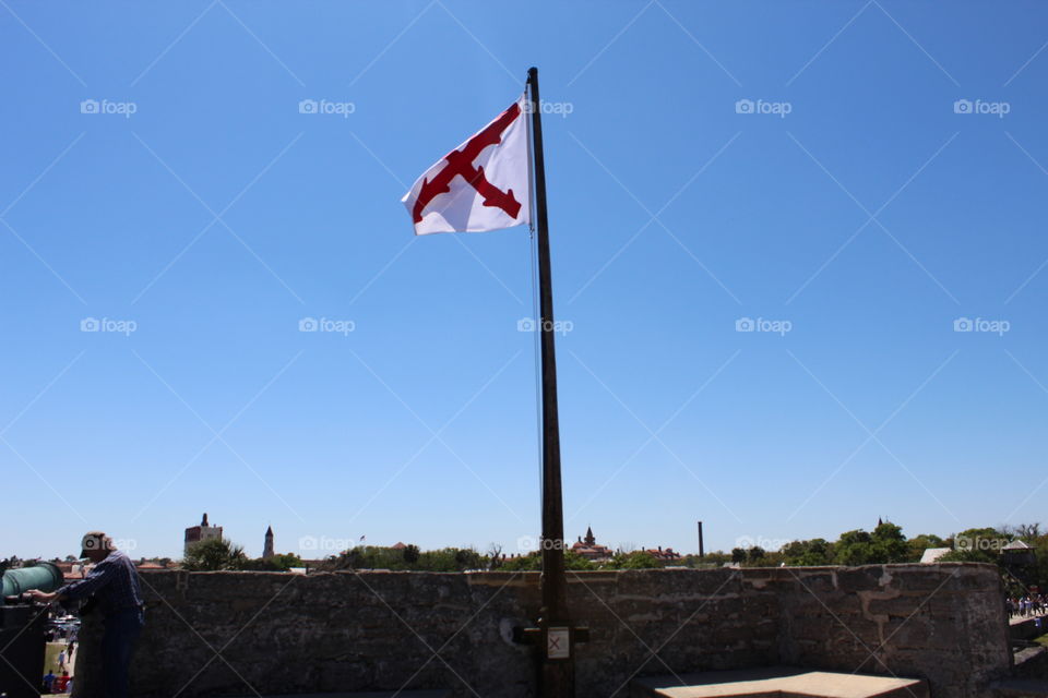 Flag waving back and forth at the fort in St Augustine, Florida