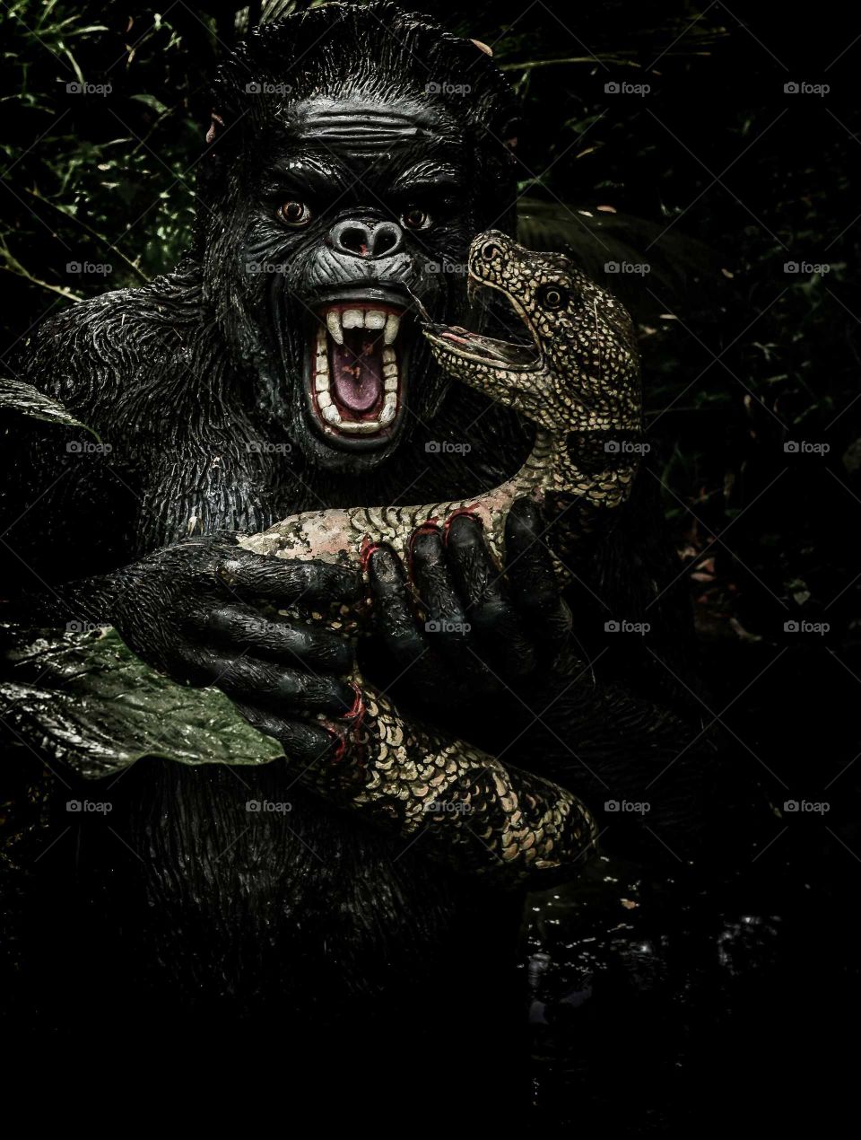 kingkong and anaconda fight depicted. awesome statute converted into fine art photography