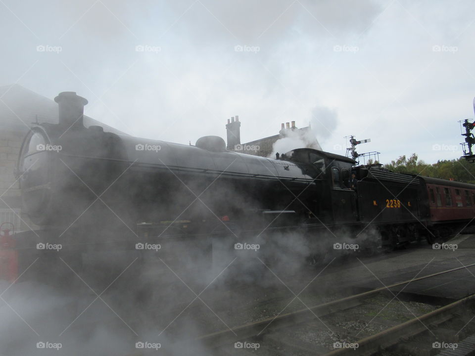 Steam train leaving Grosmont in a haze of smoke