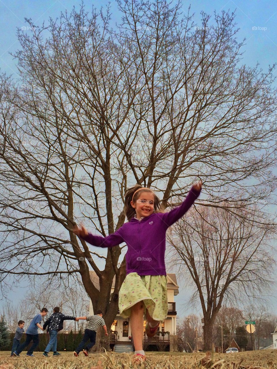 Running through the yard on a spring evening