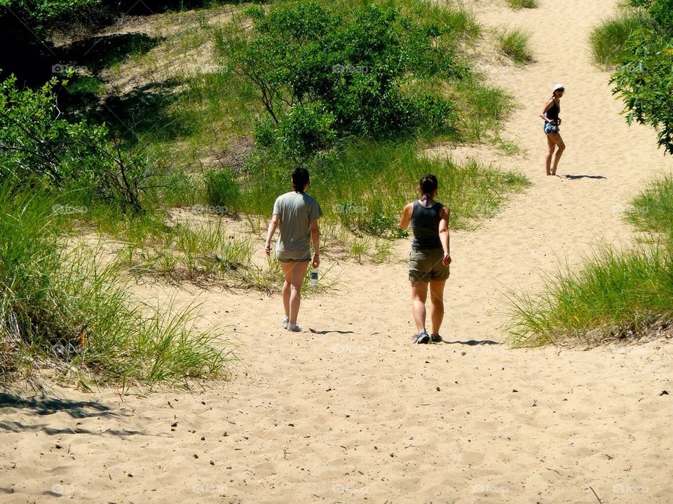 People hiking. Sand dunes in michigan 