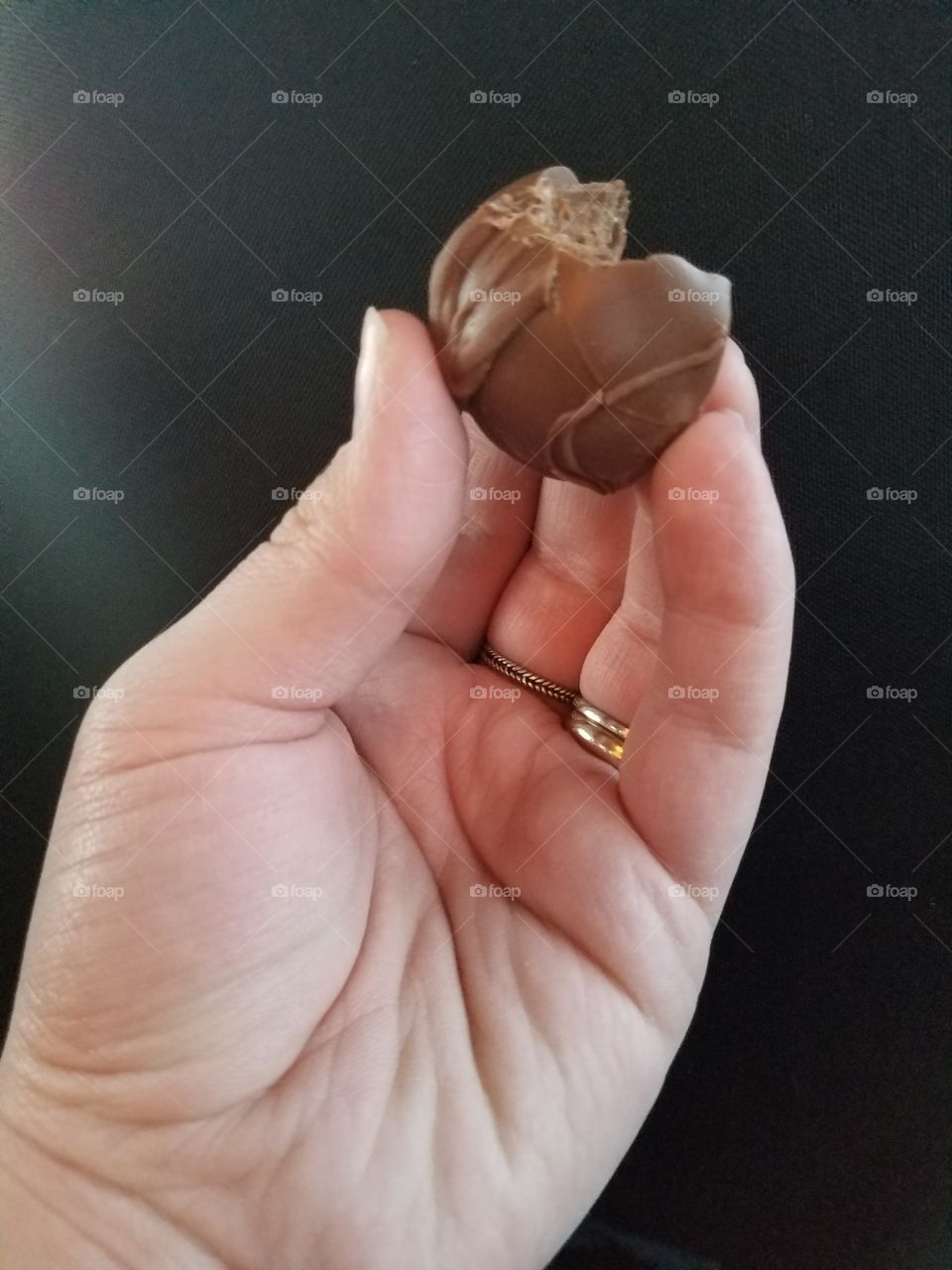 A person holding a chocolate
