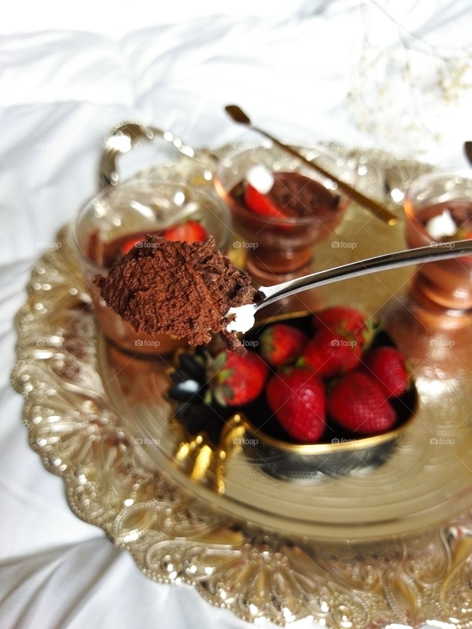 Classic dark mousse of chocolate dessert on a spoon