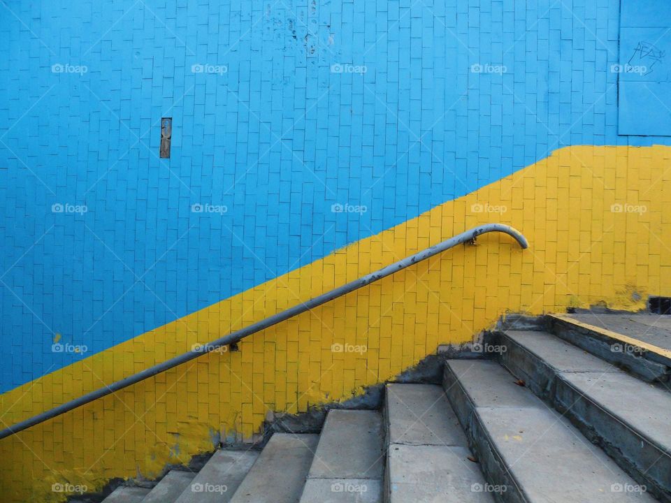 blue-yellow underpass wall