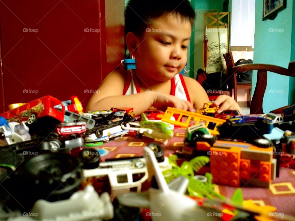 Little boy playing with toys