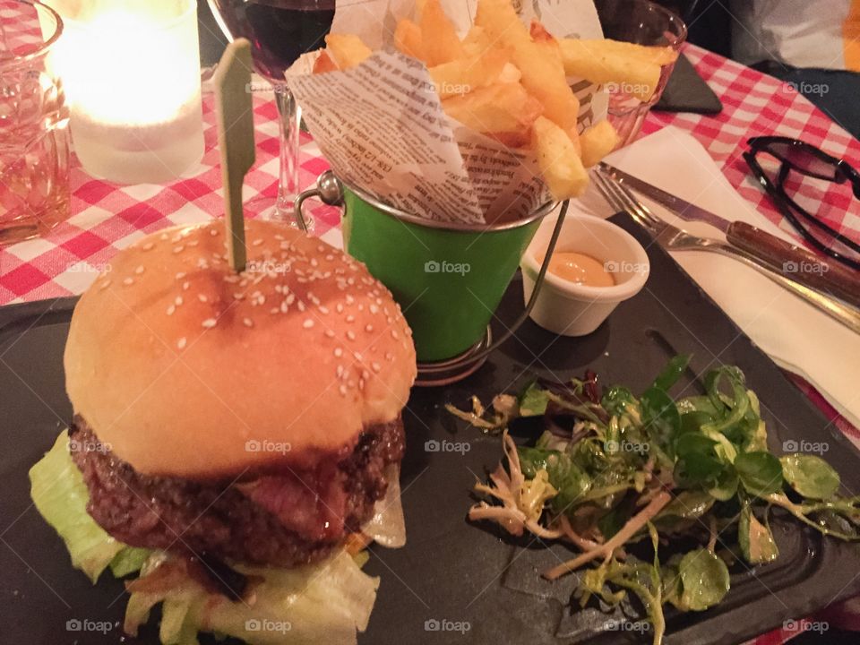 Le chat noir famous restaurant in Paris, hamburger and fries.