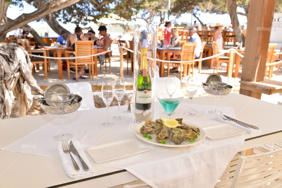 Oysters in the shell served with lemon 