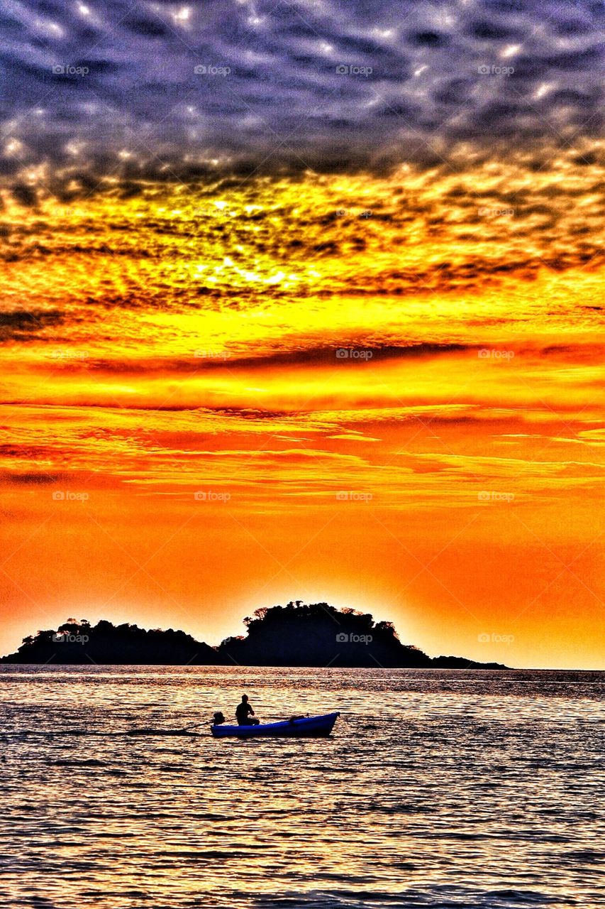 Fisherman and dog at Sunset . Fisherman and dog at sunset