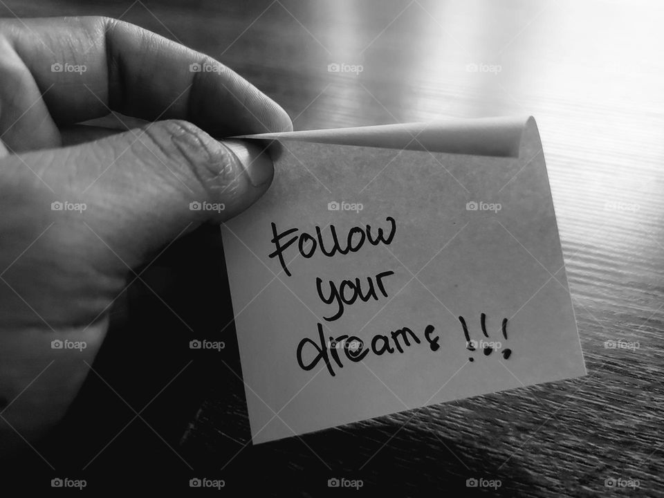 Motivational quotes on a small piece of paper