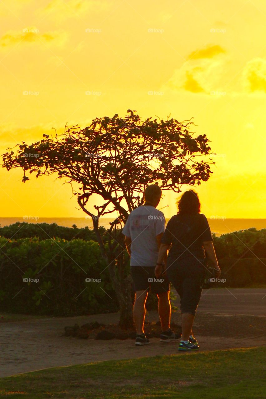 Holdind hands at sunset