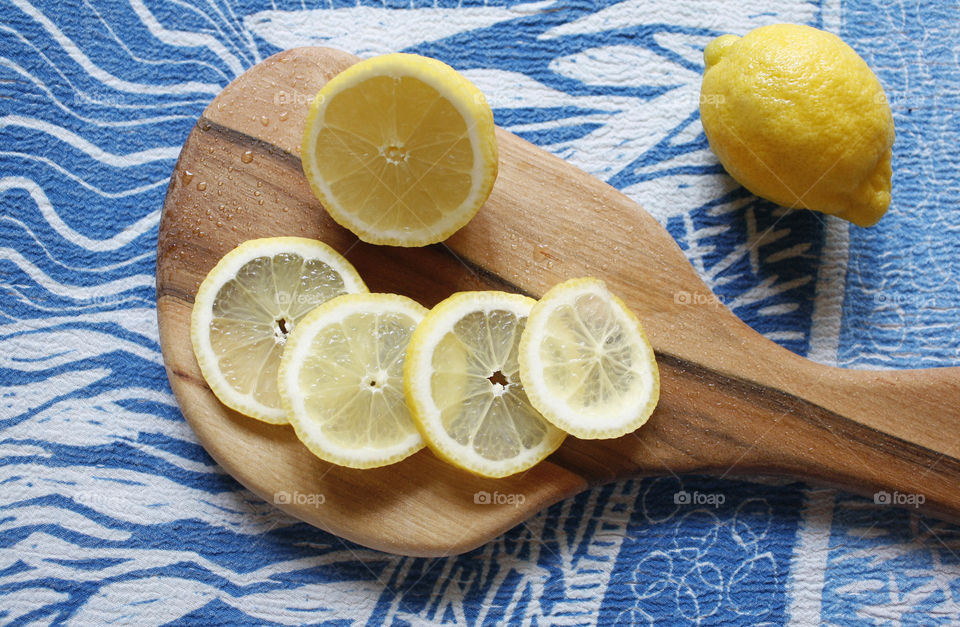 Lemons on wooden cutting board