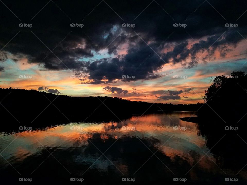 dark clouds over pink sunset