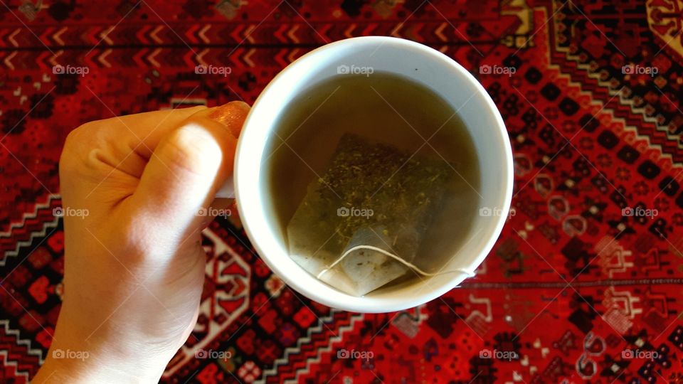 hand holding tea