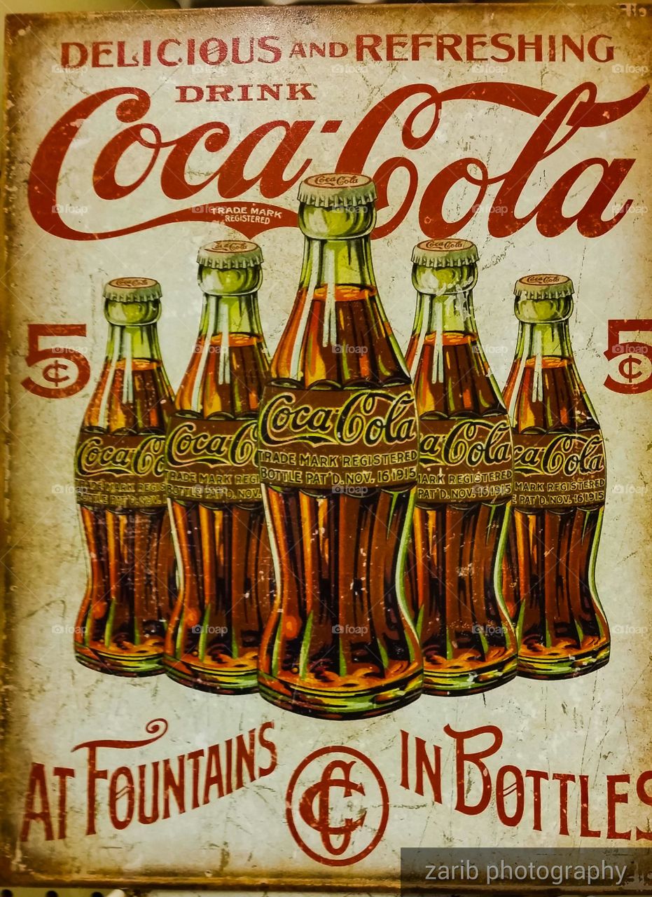 advertising sign of Coca-Cola, old
 vintage art, decorative.