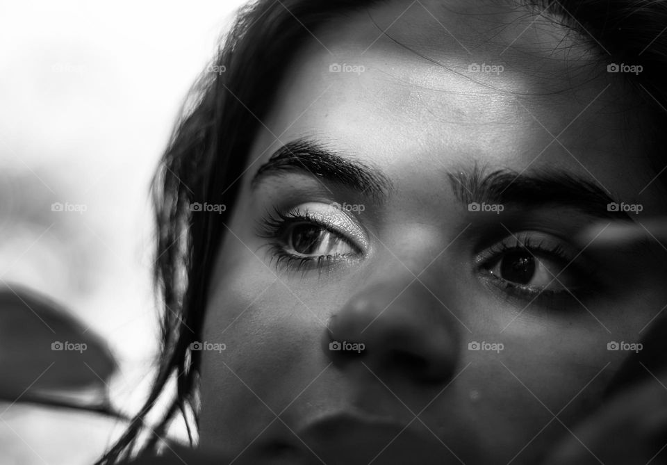 Black and white close up portrait of a teenage woman