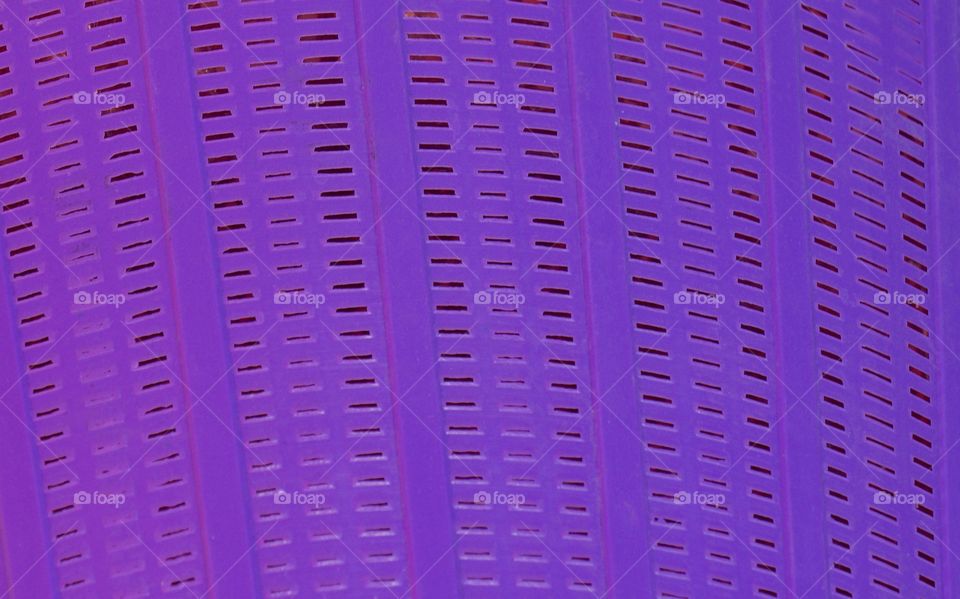 An empty purple laundry basket