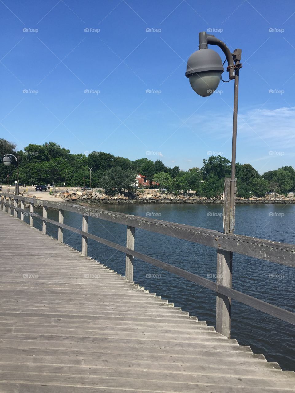 Pier with water and rock barrier captured 