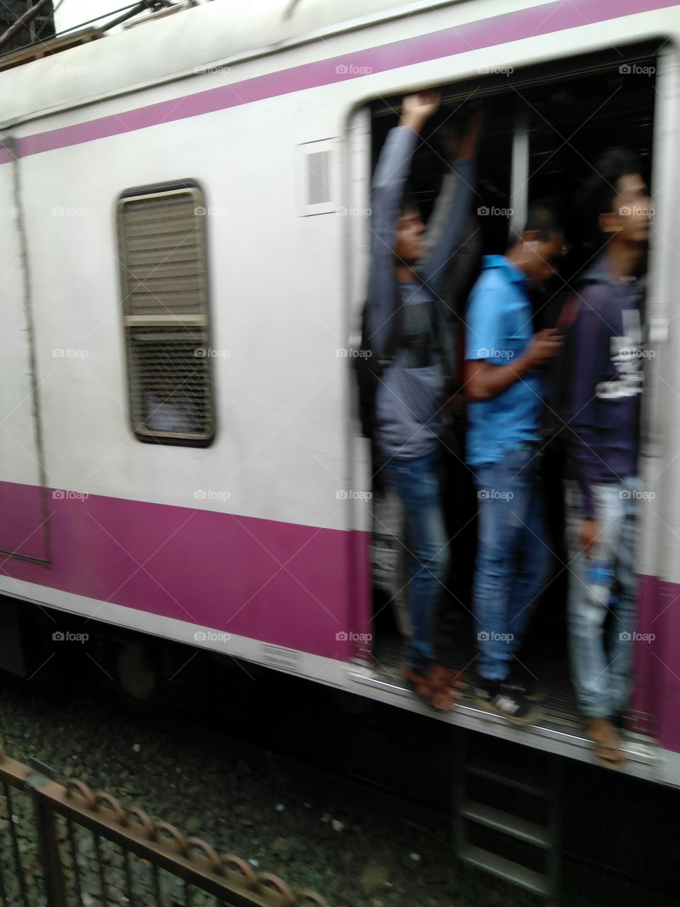 Lean on door ... it's the life of Mumbai local