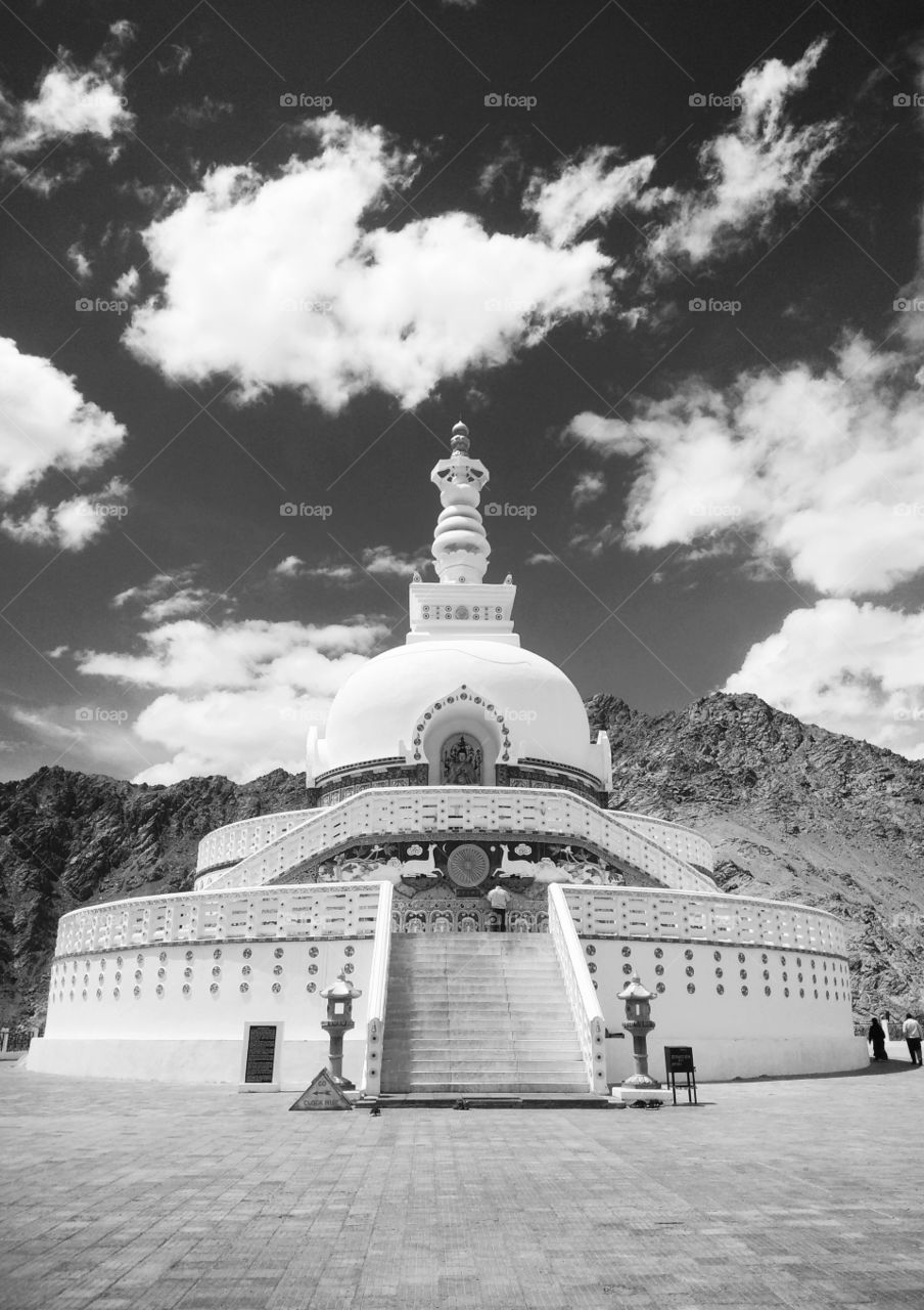 shanti stupa at leh. Shanti Stupa is a Buddhist white-domed stupa (chorten) on a hilltop in Chanspa, Leh district, Ladakh, in the north Indian state of Jammu and Kashmir.It was built in 1991 by Japanese Buddhist Bhikshu, Gyomyo Nakamura and part