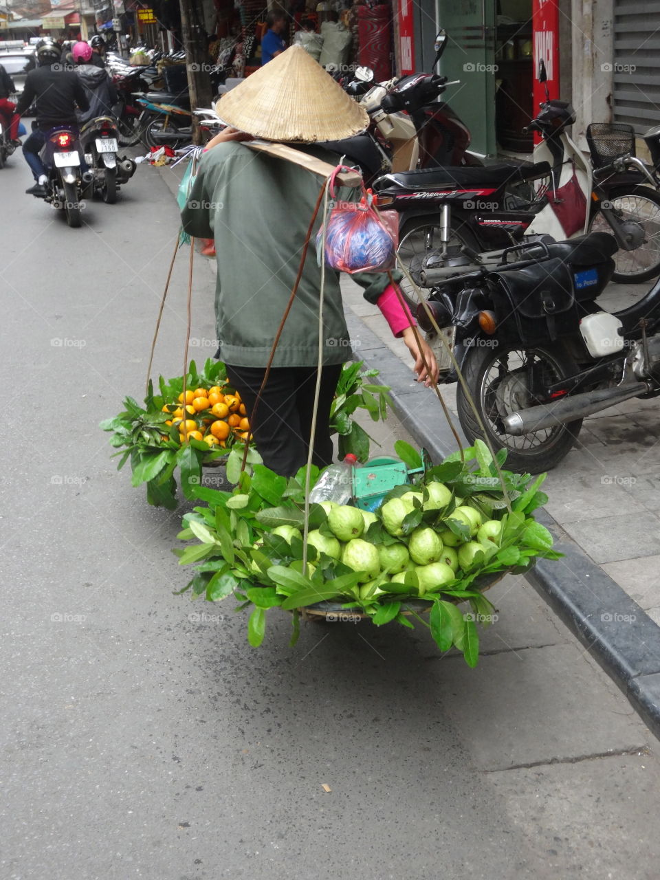 transporting fruit in Hanoi