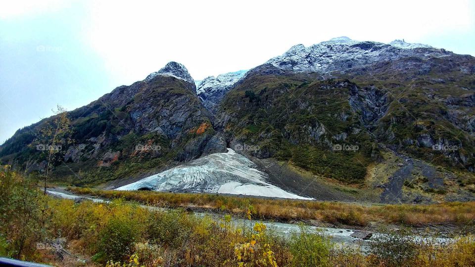 Glacial flow down from Canada's snow covered peaks on a late autumn day.
