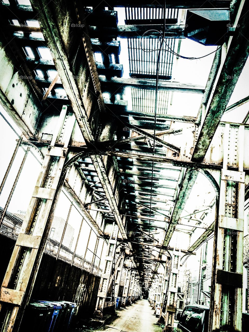 Under the El. Chicago, the city of broad shoulders, is best illustrated by the intricate iron work that comprises the structure of the city's fabled elevated train system.