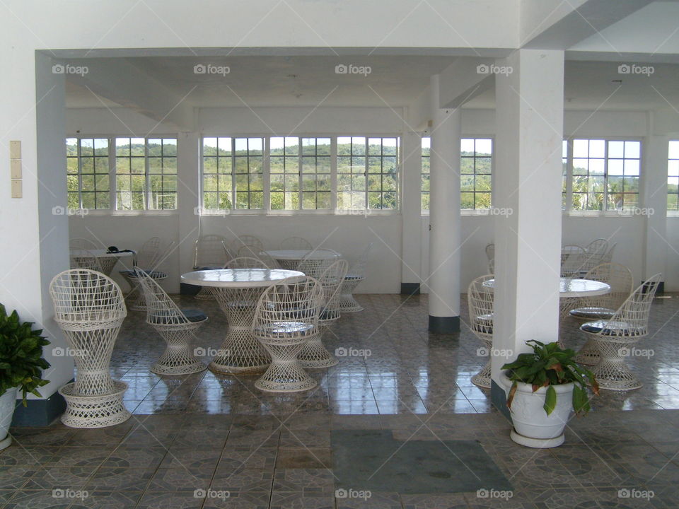 Beautiful dining area, set out of white furnitures, calm, romantic relaxing atmosphere