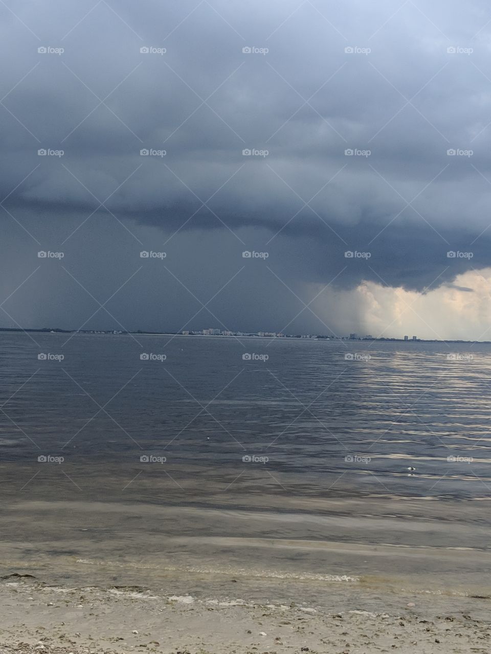 storm rolling over Fort Myers, FL as seen from Sanibel island causeway.