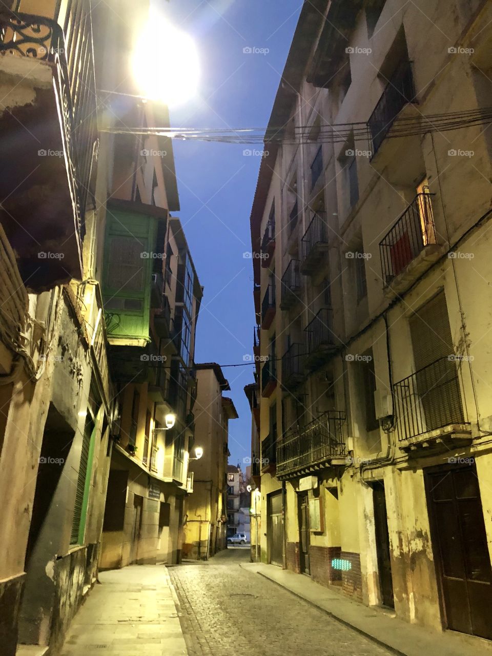 A chilly twilight on a Spanish street, in a crumbling but still quaint village in the Aragon Province. Much of the town was empty and deteriorating, but still held a medieval charm.