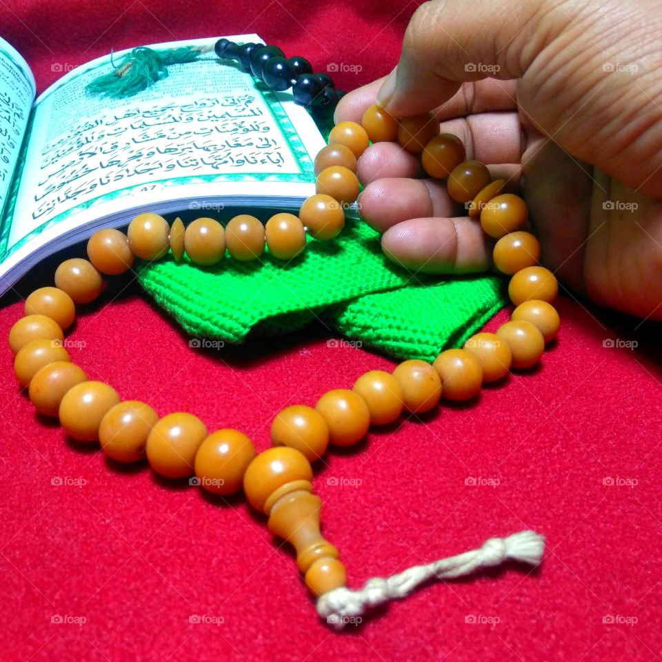 Prayer bead and green cap