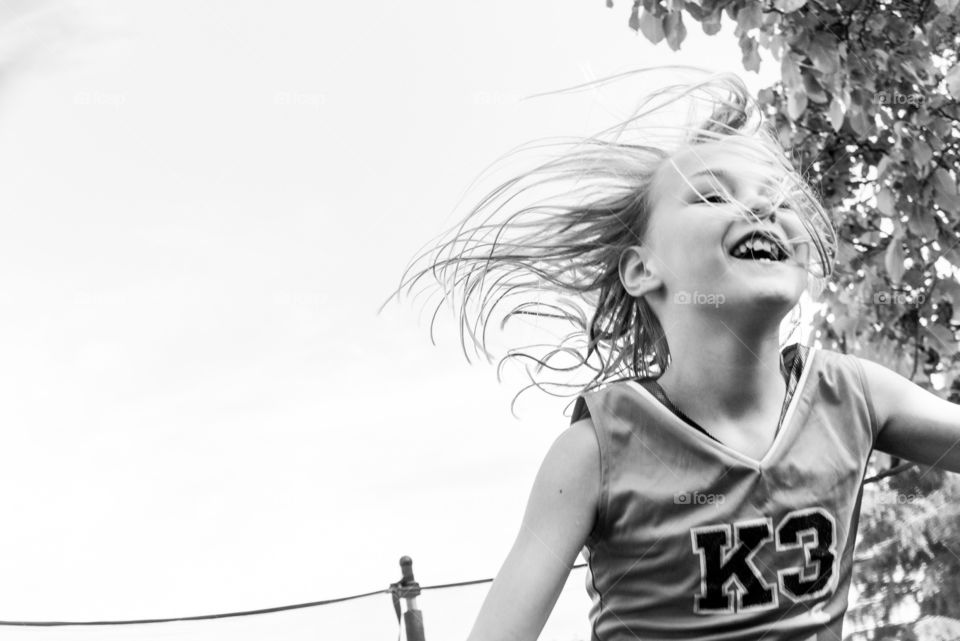 Summerfun jumping on trampoline