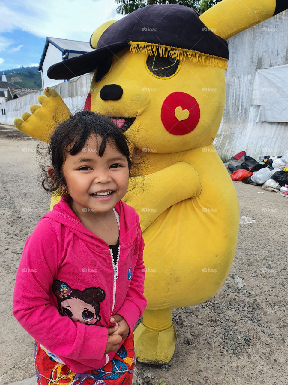 a girl playing with pokemon clown
