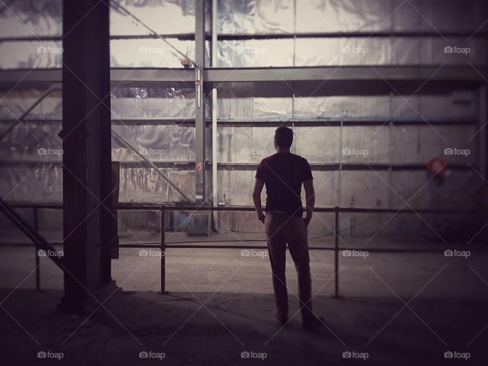 Man standing in empty building