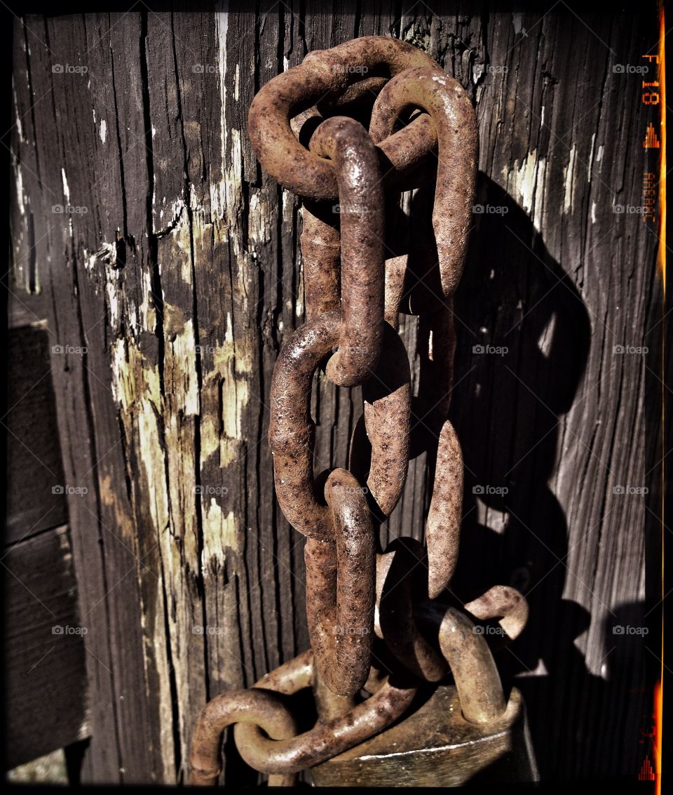 Closeup of chains on a fence