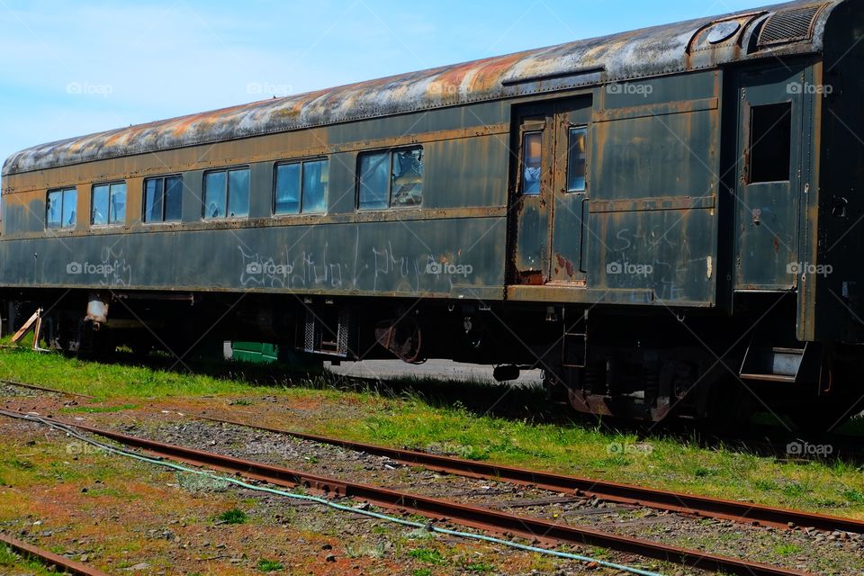 Rusted train passangers train coach in a yard