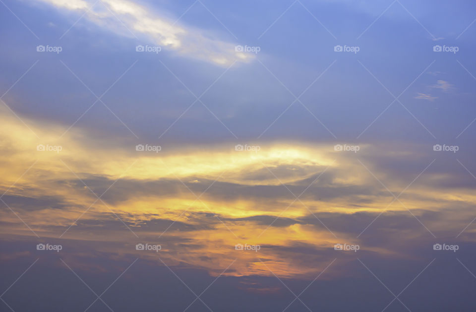 Sky and clouds reflected sunset light.