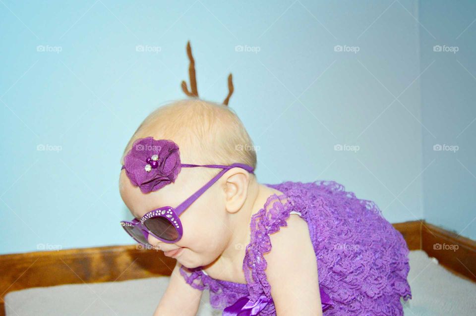 stylish baby in purple