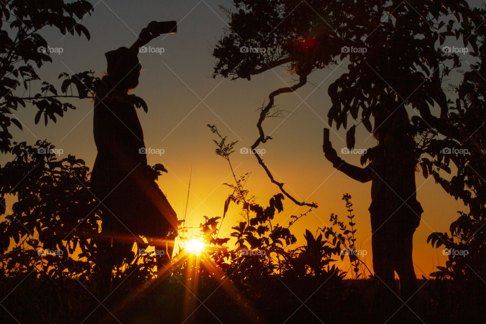 Tourists recorded the sunrise.