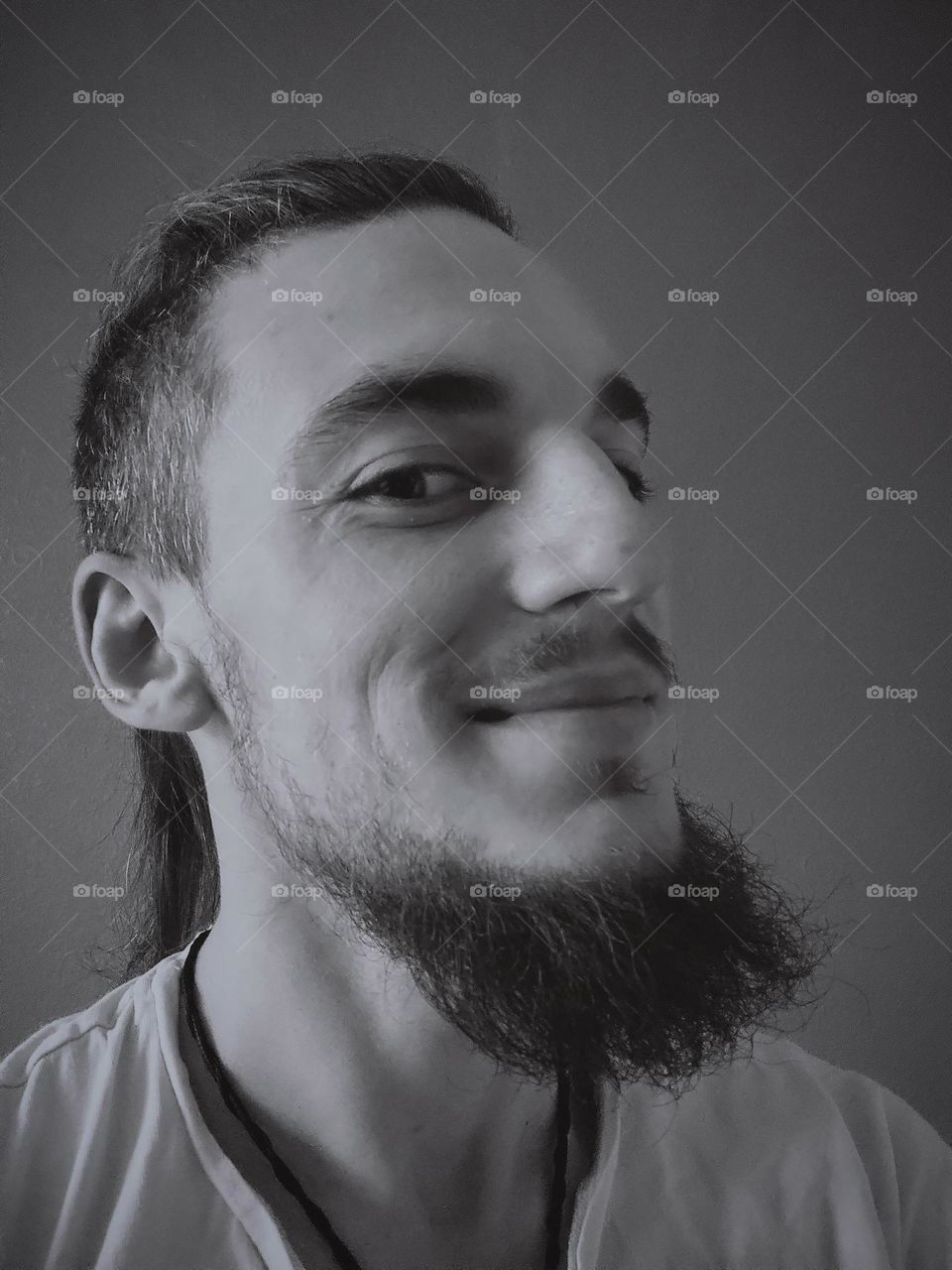 a smiling man with a beard