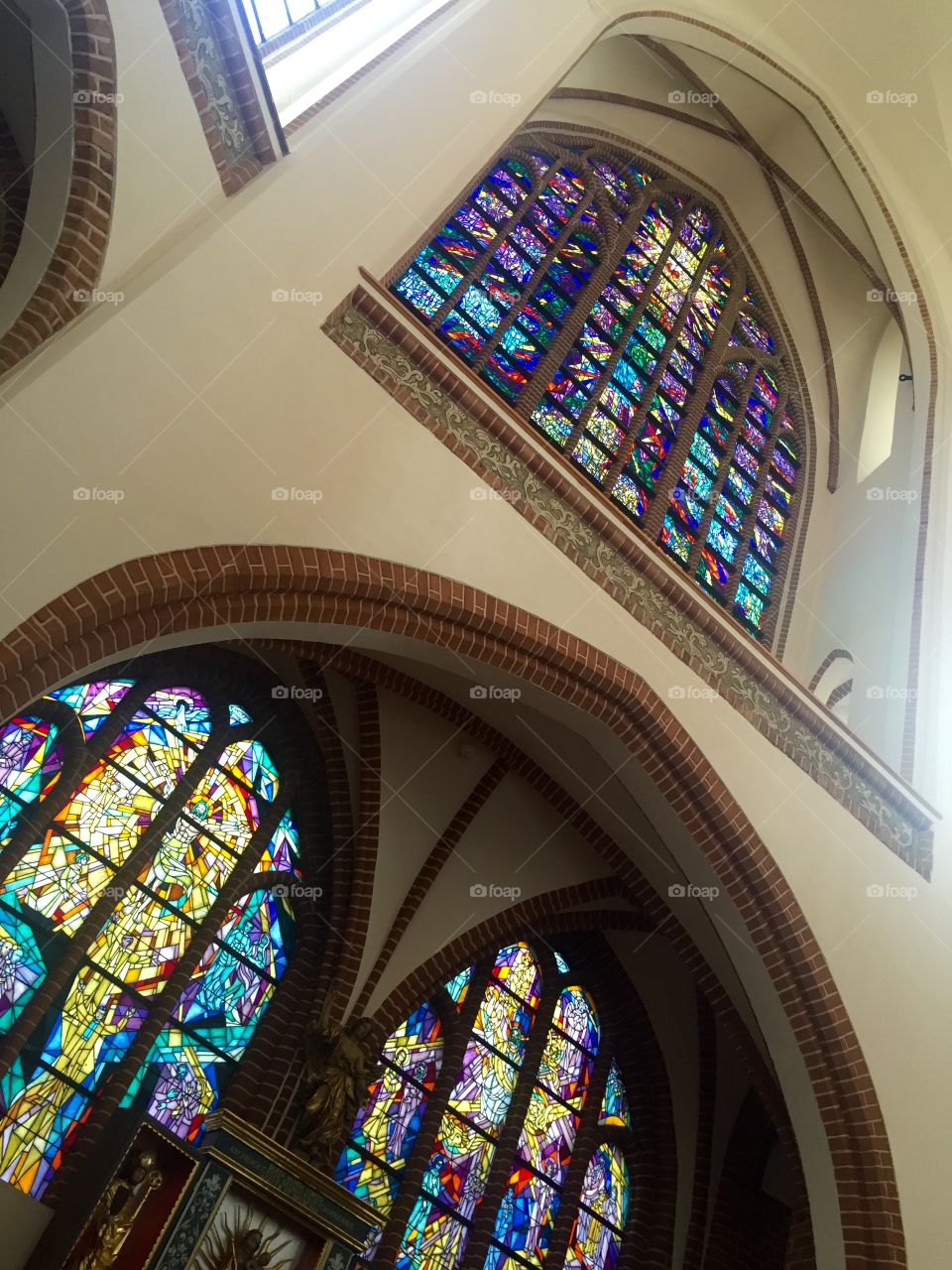 Stained glass windows in a Roman Catholic Church