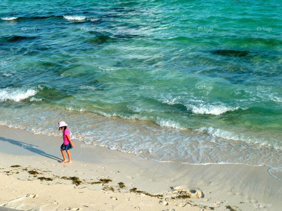 young girl on the beach in Yoron to
