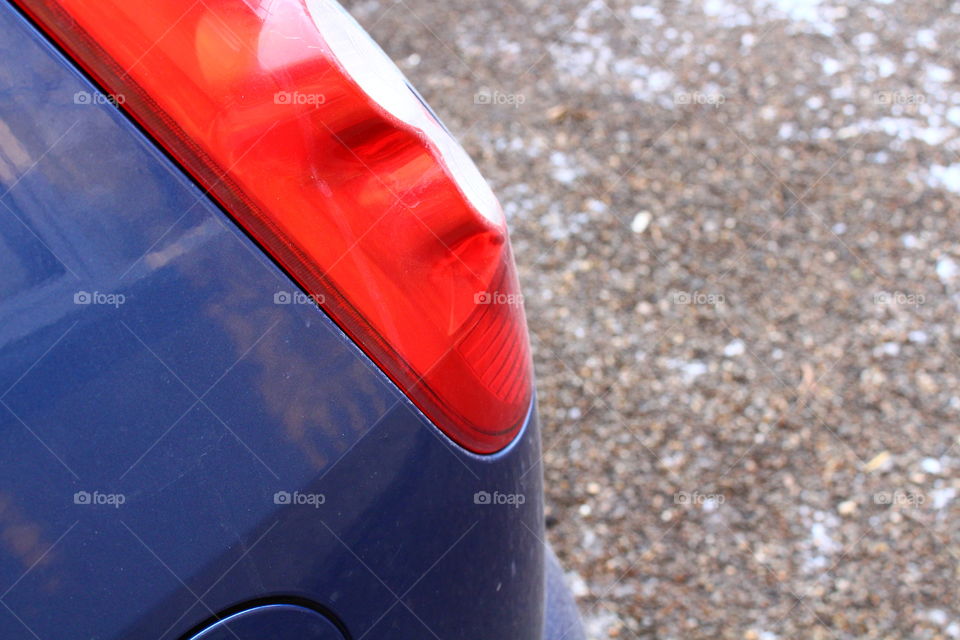 Close-up of blue car with red taillights