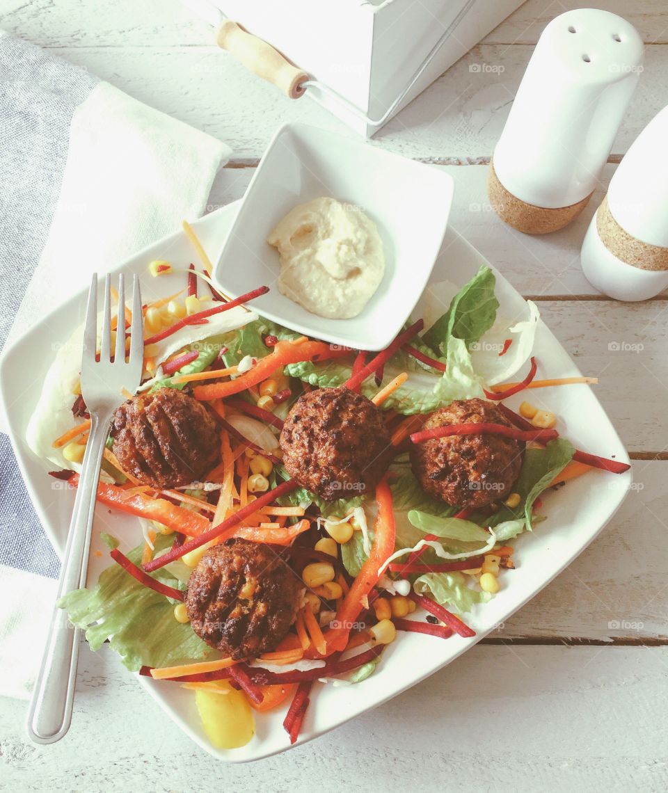 Falafel and salad with hummus dip for starters 