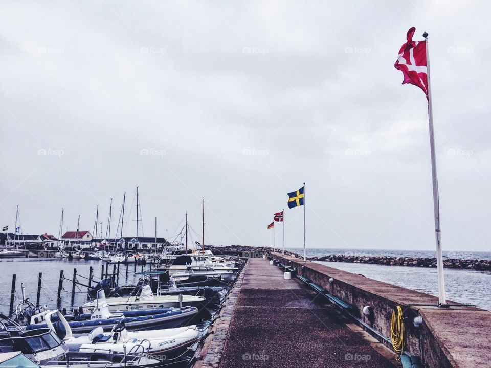 Sight from the pier in Mölle with flags 