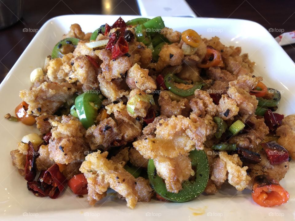 Chinese Traditional cooked Szechuan chicken stir fried with jalapeños and chili