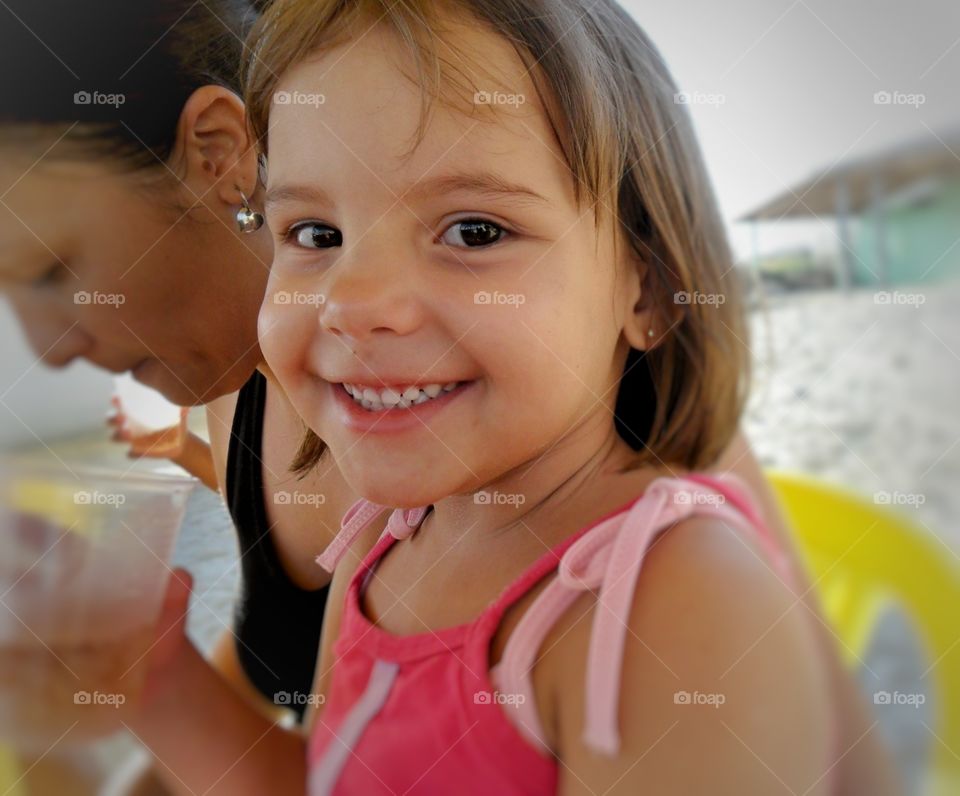 Girl smiling on the beach